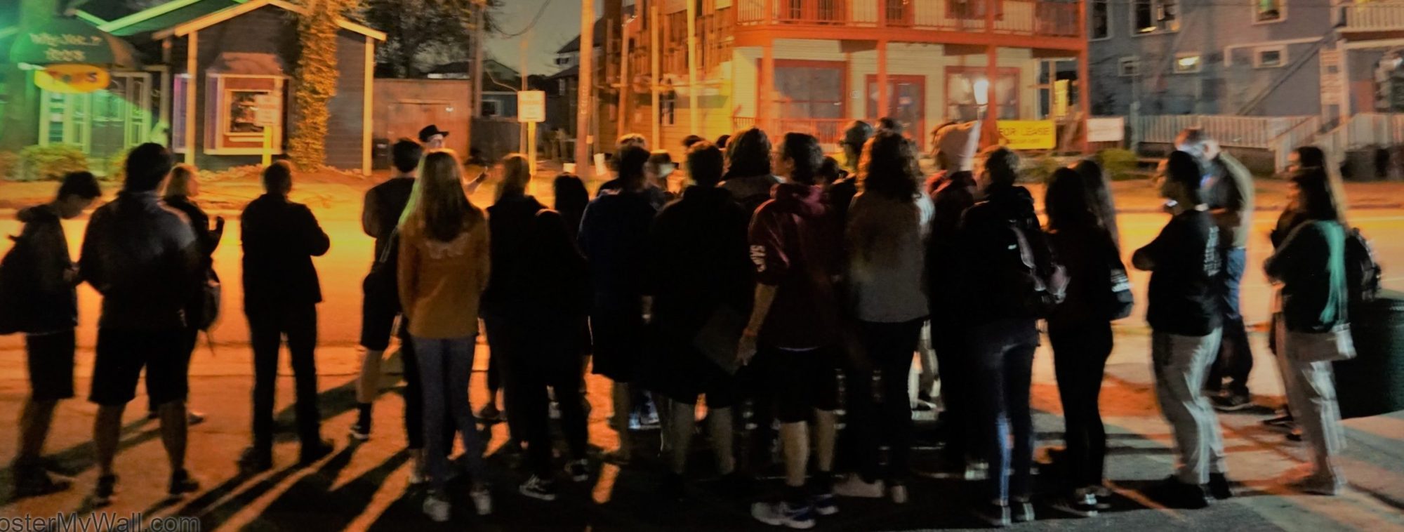 a group of people walking down a street