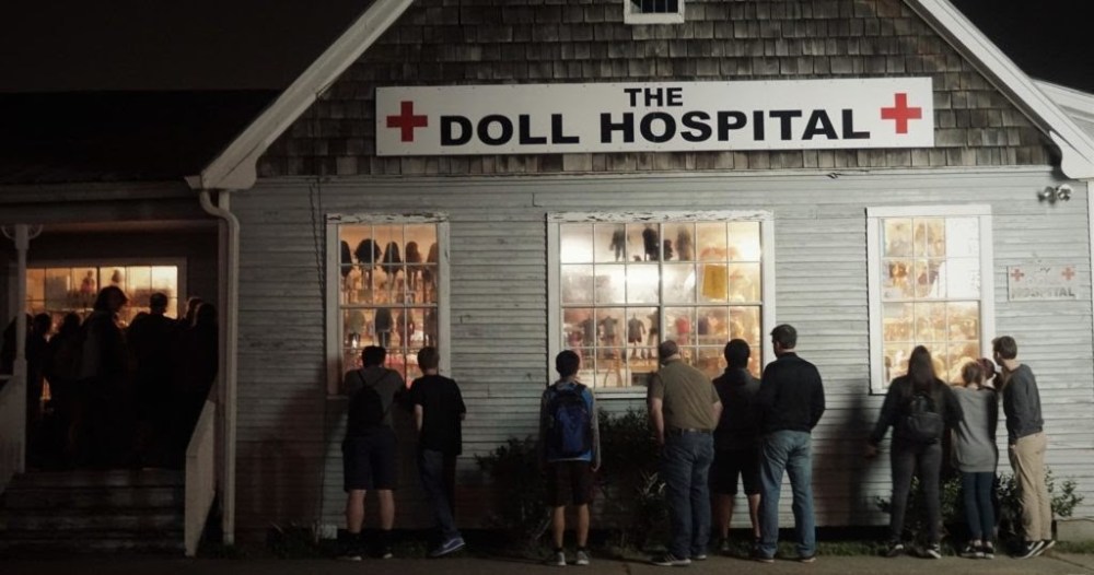 a group of people standing in front of a building